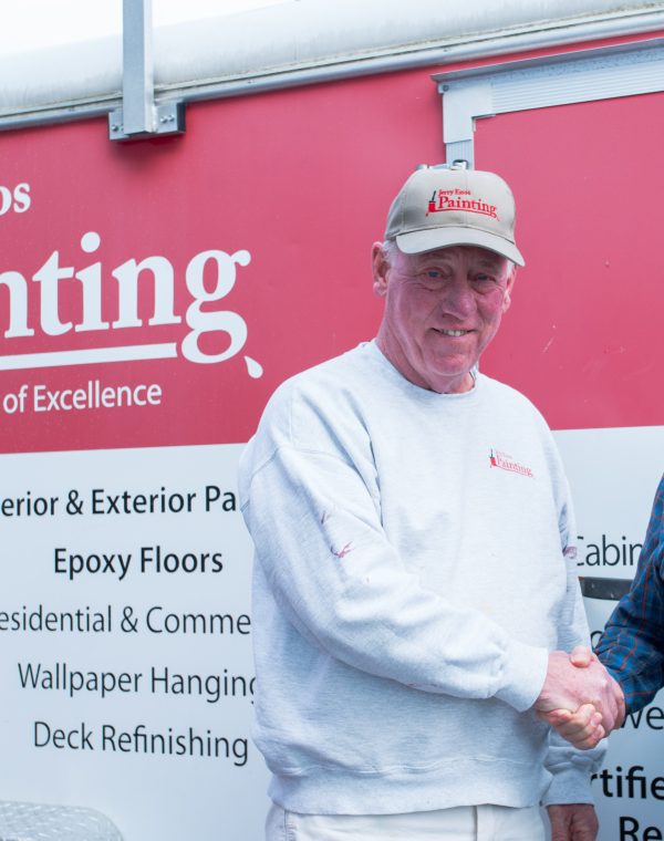 Jerry Enos and Mike McManus shaking hands
